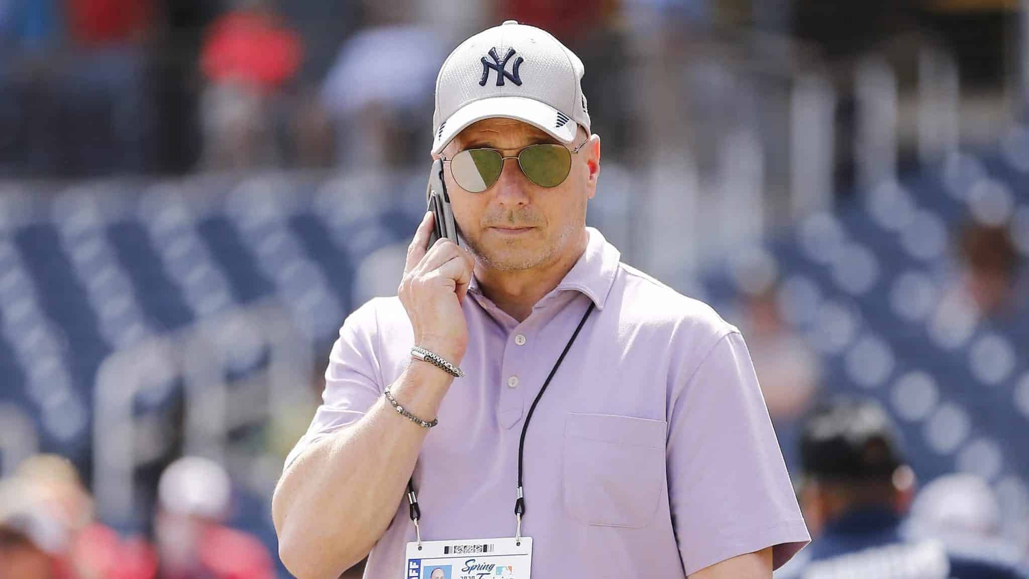 WEST PALM BEACH, FLORIDA - MARCH 12: New York Yankees general manager Brian Cashman talks on the phone prior to a Grapefruit League spring training game between the Washington Nationals and the New York Yankees at FITTEAM Ballpark of The Palm Beaches on March 12, 2020 in West Palm Beach, Florida. Many professional and college sports are canceling or postponing their games due to the ongoing threat of the Coronavirus (COVID-19) outbreak.