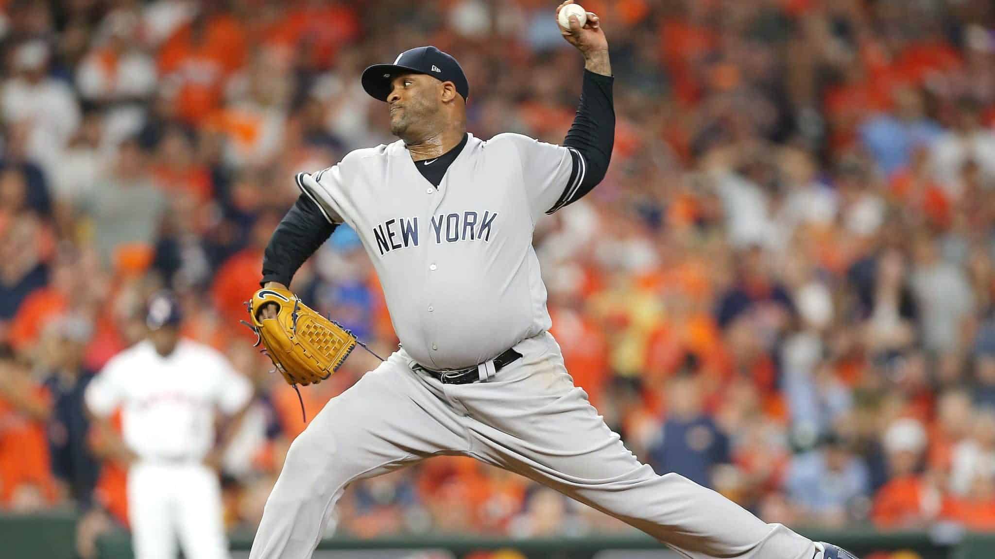 HOUSTON, TEXAS - OCTOBER 13: CC Sabathia #52 of the New York Yankees pitches during the tenth inning against the Houston Astros in game two of the American League Championship Series at Minute Maid Park on October 13, 2019 in Houston, Texas.