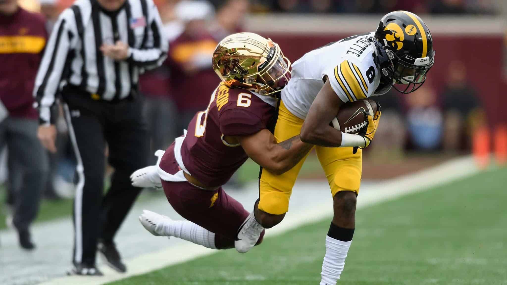 MINNEAPOLIS, MN - OCTOBER 06: Chris Williamson #6 of the Minnesota Golden Gophers pulls Ihmir Smith-Marsette #6 of the Iowa Hawkeyes out of bounds during the first quarter of the game on October 6, 2018 at TCF Bank Stadium in Minneapolis, Minnesota.