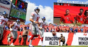 TAMPA, FLORIDA - SEPTEMBER 22: Teammates Daniel Jones #8 and Eli Manning #10 of the New York Giants take the field to warm up before their game against the Tampa Bay Buccaneers at Raymond James Stadium on September 22, 2019 in Tampa, Florida.