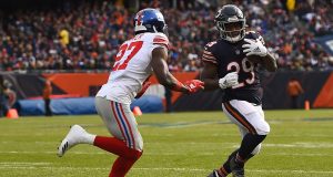 CHICAGO, ILLINOIS - NOVEMBER 24: Tarik Cohen #29 of the Chicago Bears is pursued by Deandre Baker #27 of the New York Giants during the first half at Soldier Field on November 24, 2019 in Chicago, Illinois.