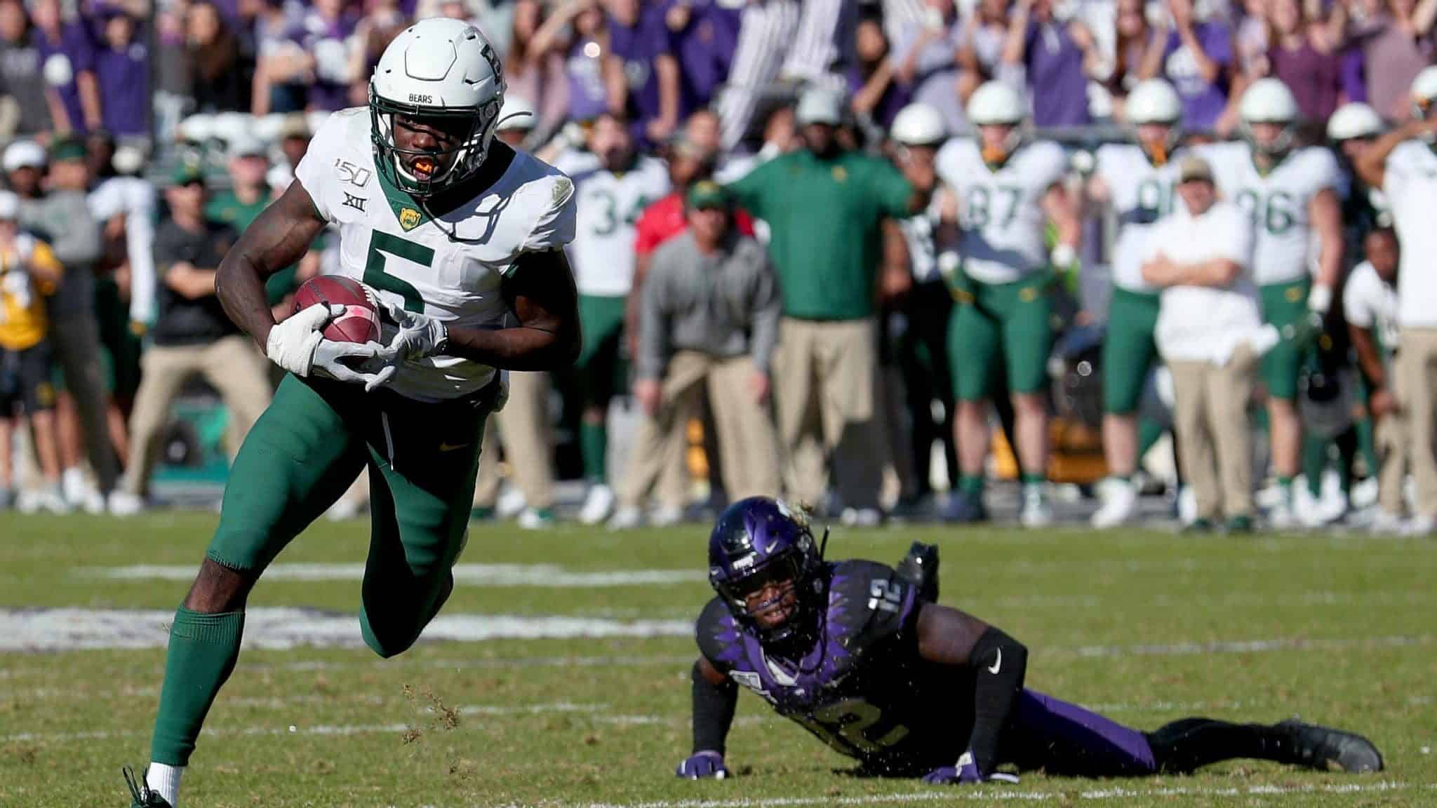 FORT WORTH, TEXAS - NOVEMBER 09: Denzel Mims #5 of the Baylor Bears scores a touchdown against Jeff Gladney #12 of the TCU Horned Frogs in the second overtime period at Amon G. Carter Stadium on November 09, 2019 in Fort Worth, Texas.