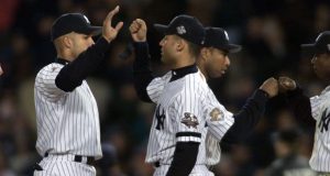 30 Oct 2001: Bernie Williams #51, Derek Jeter #2, Alfonso Soriano #33, and David Justice #28 of the New York Yankees celebrate after defeating the Arizona Diamondbacks in game 3 of the World Series at Yankee Stadium in New York, New York. The Yankees defeated the Diamondbacks 2-1. DIGITAL IMAGE