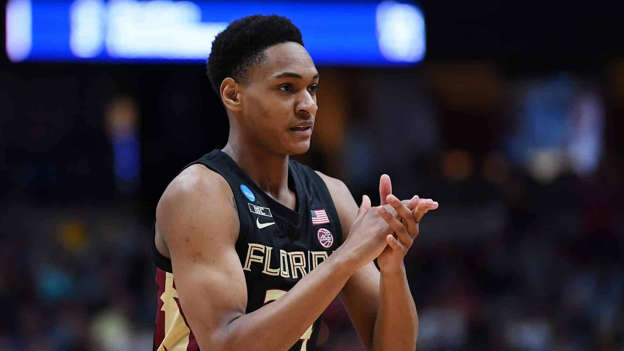 ANAHEIM, CALIFORNIA - MARCH 28: Devin Vassell #24 of the Florida State Seminoles cheers after a play against the Gonzaga Bulldogs during the 2019 NCAA Men's Basketball Tournament West Regional at Honda Center on March 28, 2019 in Anaheim, California.