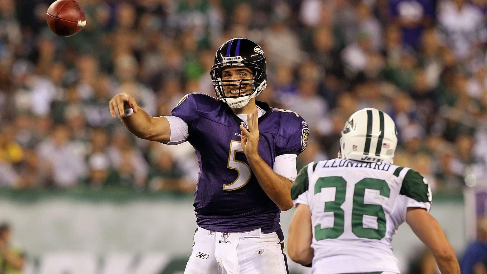 EAST RUTHERFORD, NJ - SEPTEMBER 13: Joe Flacco #5 of the Baltimore Ravens throws a pass against the New York Jets during the home opener at the New Meadowlands Stadium on September 13, 2010 in East Rutherford, New Jersey.