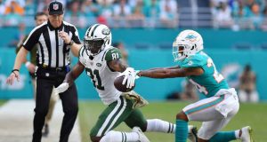 MIAMI, FL - NOVEMBER 04: Quincy Enunwa #81 of the New York Jets tries to avoid the tackle of Torry McTyer #24 of the Miami Dolphins in the first half of their game at Hard Rock Stadium on November 4, 2018 in Miami, Florida.