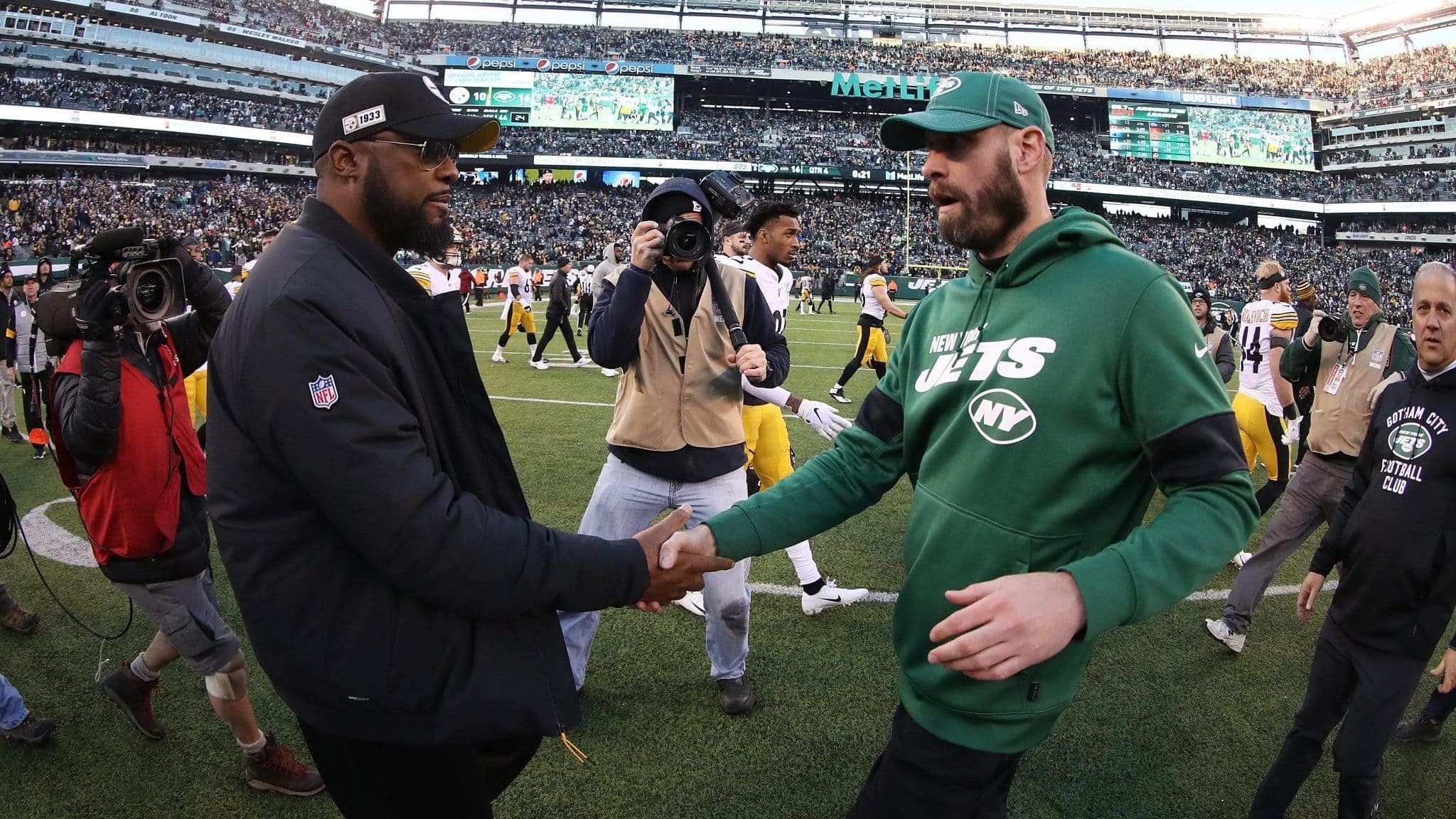 EAST RUTHERFORD, NEW JERSEY - DECEMBER 22: Head coach Mike Tomlin of the Pittsburgh Steelers meets head coach Adam Gase of the New York Jets after the Jets 16-10 win at MetLife Stadium on December 22, 2019 in East Rutherford, New Jersey.