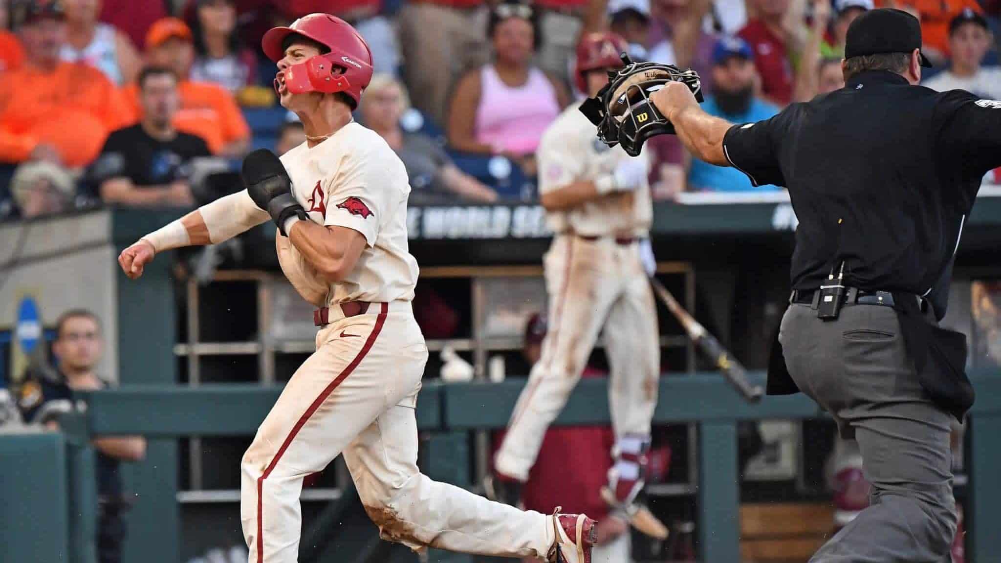 Omaha, NE - JUNE 27: Infielder Casey Martin #15 of the Arkansas Razorbacks celebrates after scoring a run in the fifth inning against the Oregon State Beavers during game two of the College World Series Championship Series on June 27, 2018 at TD Ameritrade Park in Omaha, Nebraska. New York Mets