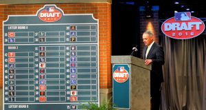 FILE - In this June 9, 2016, file photo, Major League BaseballCommissioner Rob Manfred speaks during the MLB draft, in Secaucus, N.J. Major League Baseball will cuts its amateur draft from 40 rounds to five this year, a move that figures to save teams about $30 million. Clubs gained the ability to reduce the draft as part of their March 26 agreement with the players’ association and MLB plans to finalize a decision next week to go with the minimum, a person familiar with the decision told The Associated Press. The person spoke Friday, May 8, 2020, on condition of anonymity because no decision was announced.