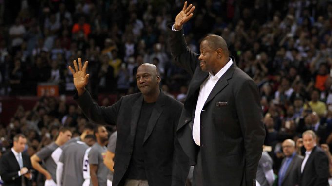 SHENZHEN, CHINA - OCTOBER 11: Michael Jordan, Owner of Charlotte Hornets and Patrick Ewing of Charlotte Hornets wave to fans during the match between Charlotte Hornets and Los Angeles Clippers as part of the 2015 NBA Global Games China at Universiade Centre on October 11, 2015 in Shenzhen, China.
