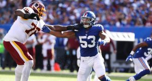 EAST RUTHERFORD, NEW JERSEY - SEPTEMBER 29: Oshane Ximines #53 of the New York Giants rushes against Morgan Moses #76 of the Washington Redskins during their game at MetLife Stadium on September 29, 2019 in East Rutherford, New Jersey.