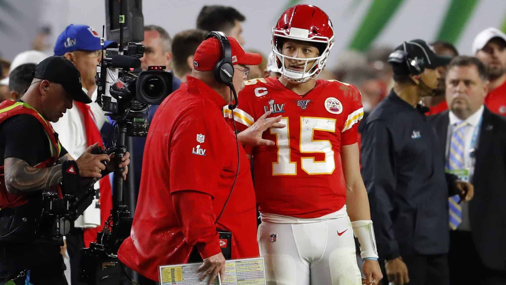 MIAMI, FLORIDA - FEBRUARY 02: Head coach Andy Reid of the Kansas City Chiefs talks to Patrick Mahomes #15 of the Kansas City Chiefs during the fourth quarter in Super Bowl LIV against the San Francisco 49ers at Hard Rock Stadium on February 02, 2020 in Miami, Florida.