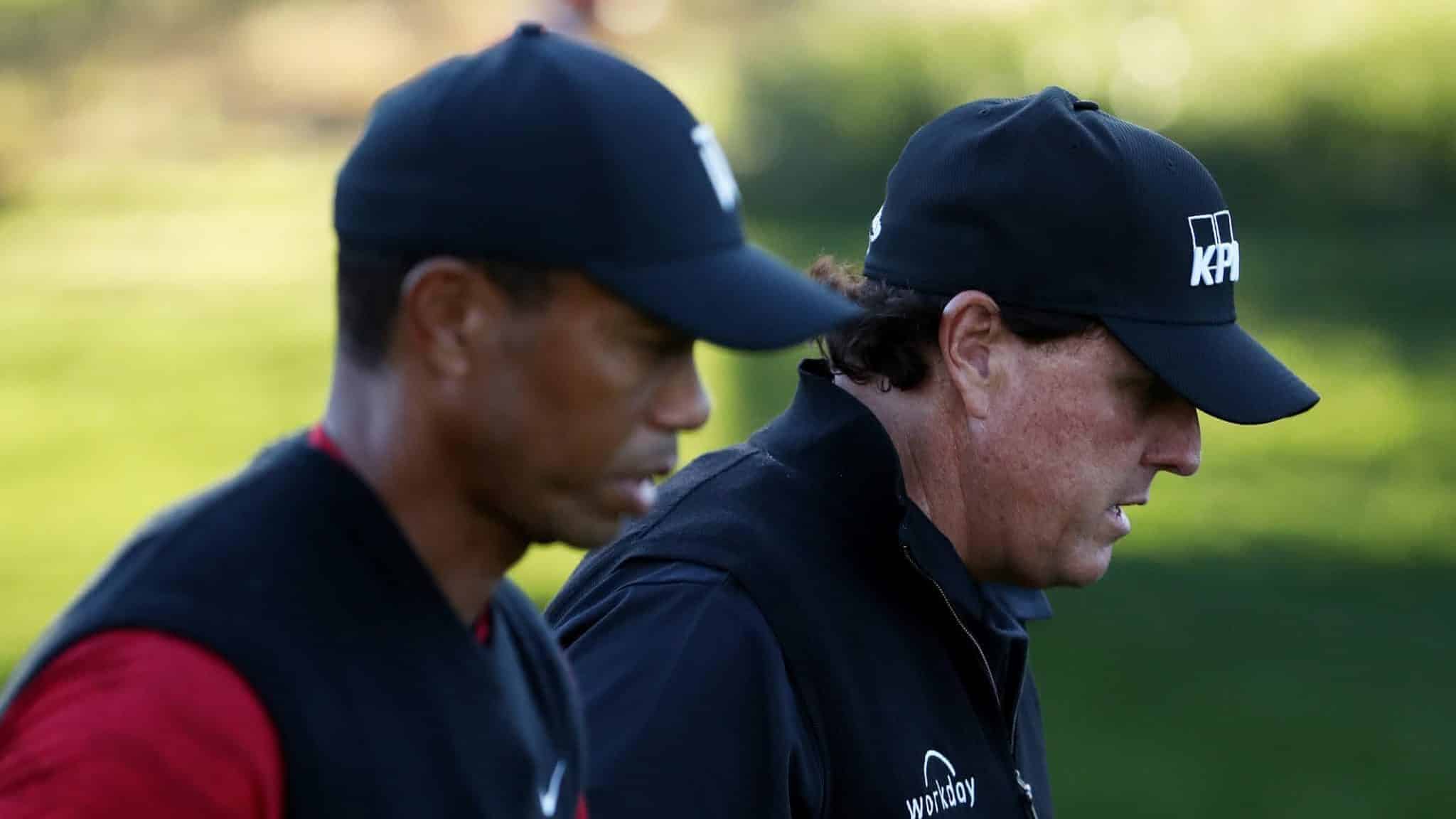 LAS VEGAS, NV - NOVEMBER 23: Tiger Woods and Phil Mickelson walk during The Match: Tiger vs Phil at Shadow Creek Golf Course on November 23, 2018 in Las Vegas, Nevada.