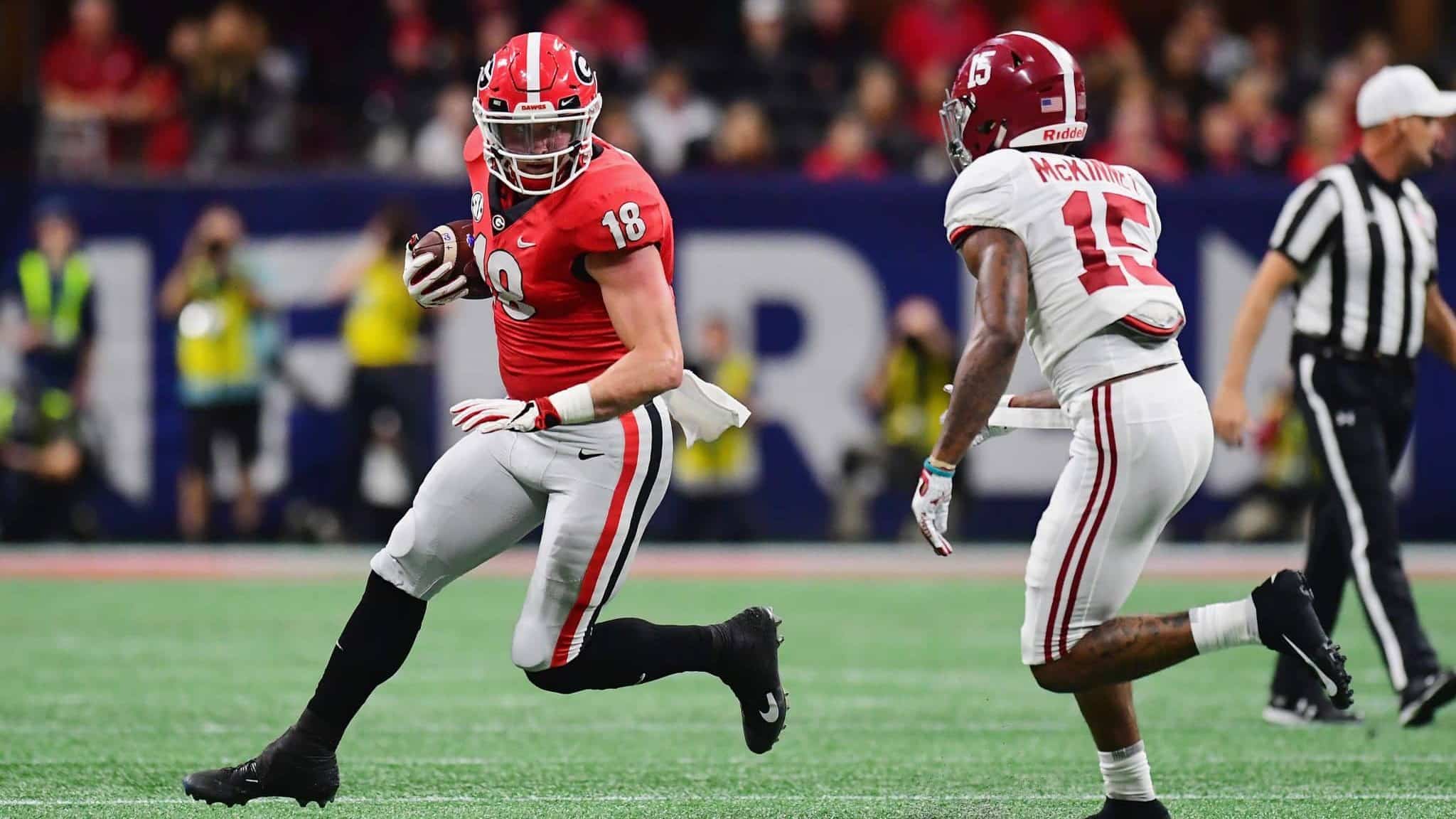 ATLANTA, GA - DECEMBER 01: Isaac Nauta #18 of the Georgia Bulldogs runs with the ball against Xavier McKinney #15 of the Alabama Crimson Tide in the first half during the 2018 SEC Championship Game at Mercedes-Benz Stadium on December 1, 2018 in Atlanta, Georgia.