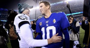 EAST RUTHERFORD, NEW JERSEY - DECEMBER 29: Josh McCown #18 of the Philadelphia Eagles greets Eli Manning #10 of the New York Giants after the second half of the game at MetLife Stadium on December 29, 2019 in East Rutherford, New Jersey.