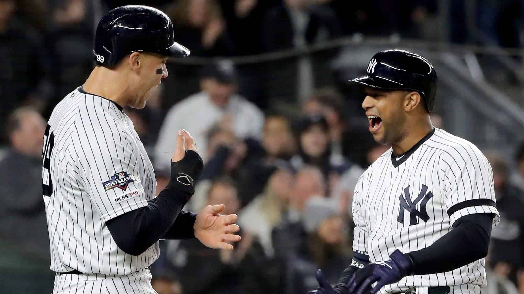NEW YORK, NEW YORK - OCTOBER 18: Aaron Hicks #31 of the New York Yankees celebrates with Aaron Judge #99 after hitting a three run home run against Justin Verlander #35 of the Houston Astros during the first inning in game five of the American League Championship Series at Yankee Stadium on October 18, 2019 in New York City.