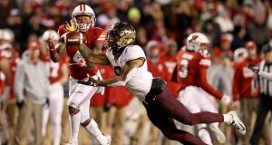 MADISON, WISCONSIN - NOVEMBER 24: Chris Williamson #6 of the Minnesota Golden Gophers intercepts a pass intended for A.J. Taylor #4 of the Wisconsin Badgers in the fourth quarter at Camp Randall Stadium on November 24, 2018 in Madison, Wisconsin.
