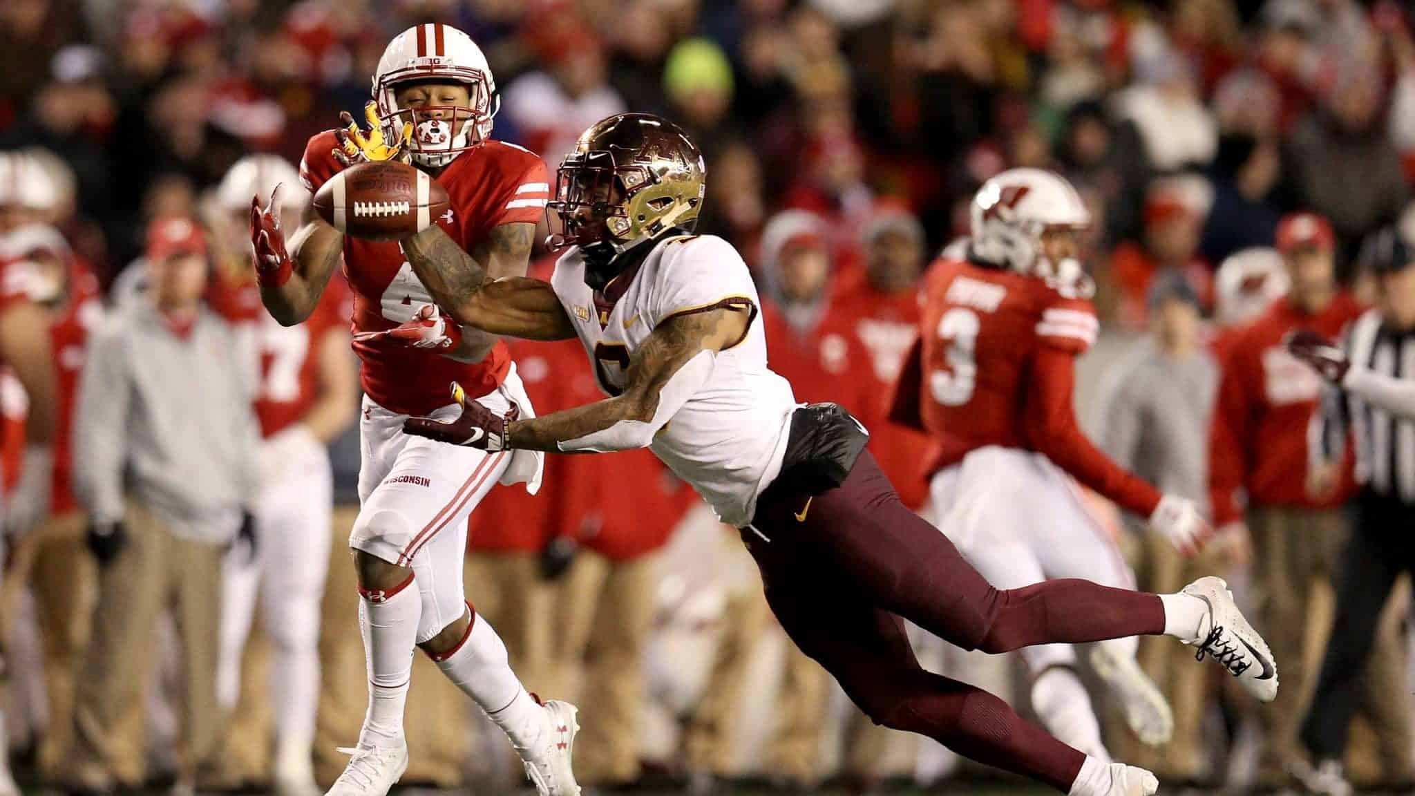 MADISON, WISCONSIN - NOVEMBER 24: Chris Williamson #6 of the Minnesota Golden Gophers intercepts a pass intended for A.J. Taylor #4 of the Wisconsin Badgers in the fourth quarter at Camp Randall Stadium on November 24, 2018 in Madison, Wisconsin.