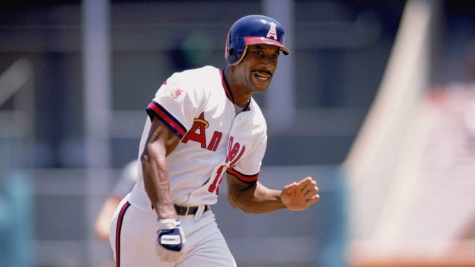 ANAHEIM, CA - 1989: Claudell Washington #18 of the California Angels celebrates during the 1989 season game at Anaheim Stadium in Anaheim, California.