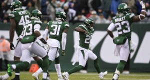 EAST RUTHERFORD, NEW JERSEY - NOVEMBER 24: Free safety Marcus Maye #20 of the New York Jets and his teammates react after stopping the Oakland Raiders one yard short of a first down during the second half of the game at MetLife Stadium on November 24, 2019 in East Rutherford, New Jersey.