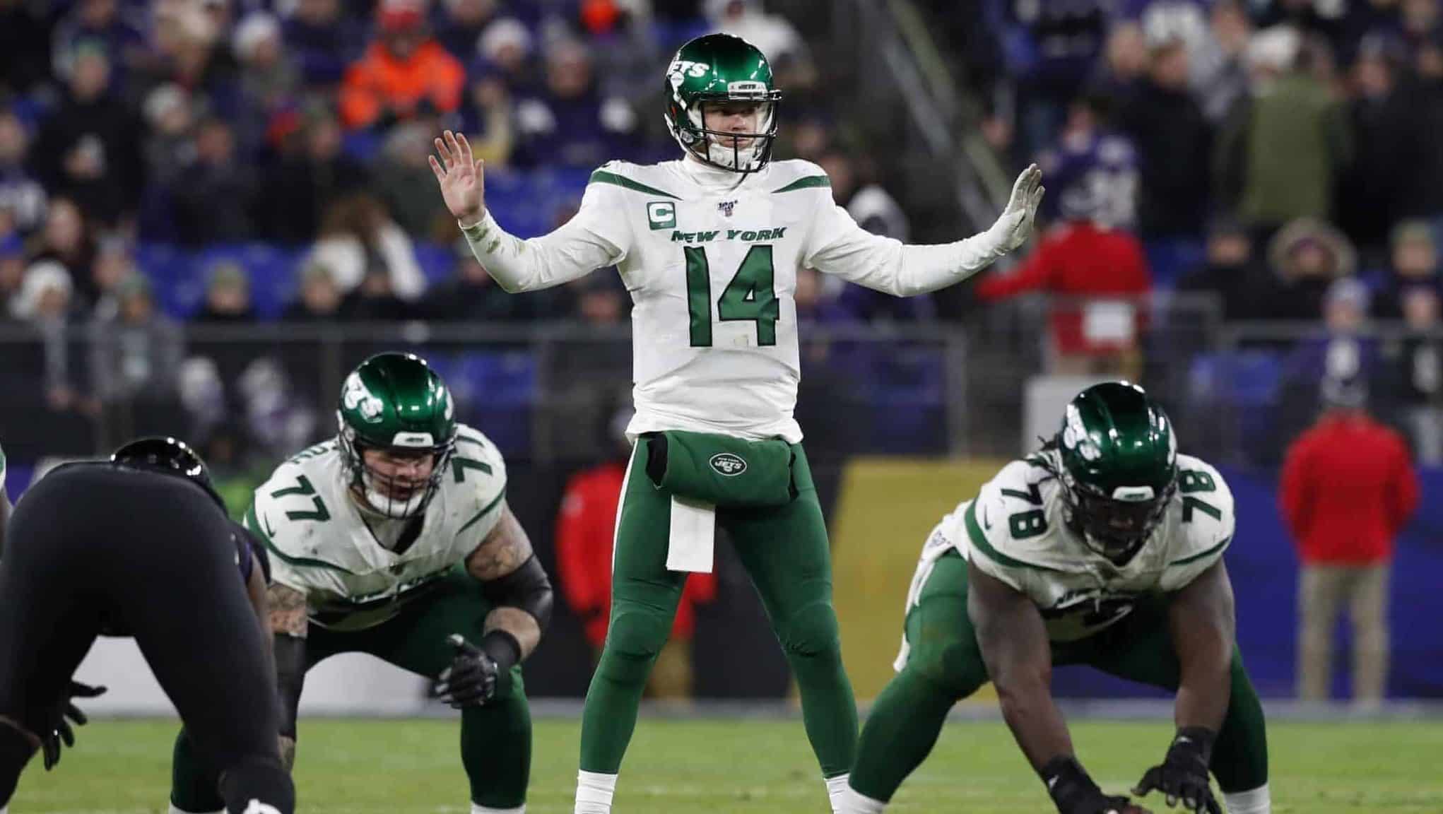 BALTIMORE, MARYLAND - DECEMBER 12: Quarterback Sam Darnold #14 of the New York Jets signals at the line of scrimmage during the second quarter against the Baltimore Ravens at M&T Bank Stadium on December 12, 2019 in Baltimore, Maryland.