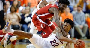 AUBURN, ALABAMA - FEBRUARY 12: Allen Flanigan #22 of the Auburn Tigers grabs a loose ball against Kira Lewis Jr. #2 of the Alabama Crimson Tide in the second half at Auburn Arena on February 12, 2020 in Auburn, Alabama.