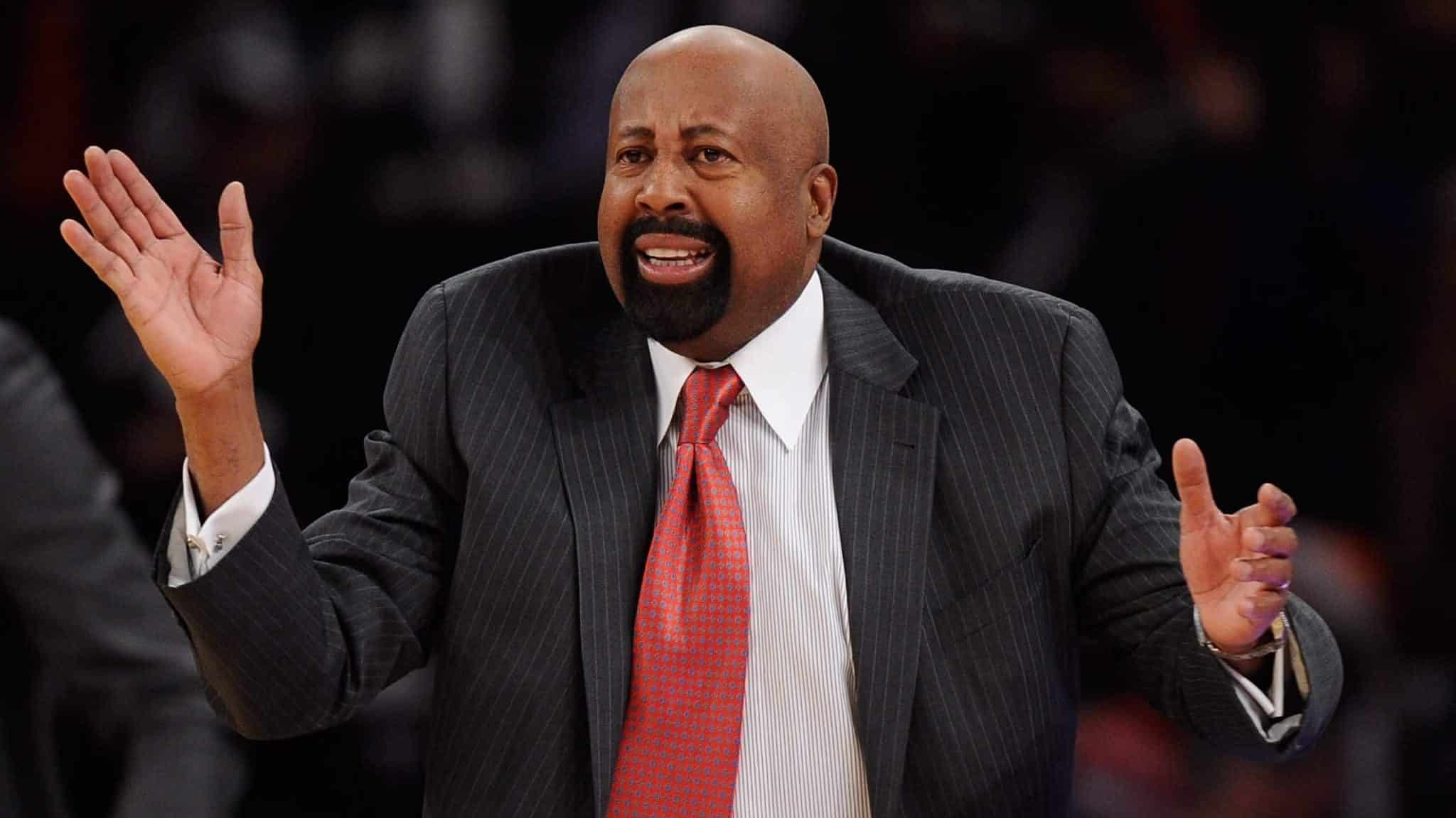 NEW YORK, NY - DECEMBER 16: New York Knicks head coach Mike Woodson directs his team during the second half against the Washington Wizards at Madison Square Garden on December 16, 2013 in New York City. NOTE TO USER: User expressly acknowledges and agrees that, by downloading and/or using this photograph, user is consenting to the terms and conditions of the Getty Images License Agreement. The Wizards defeat the Knicks 102-101.