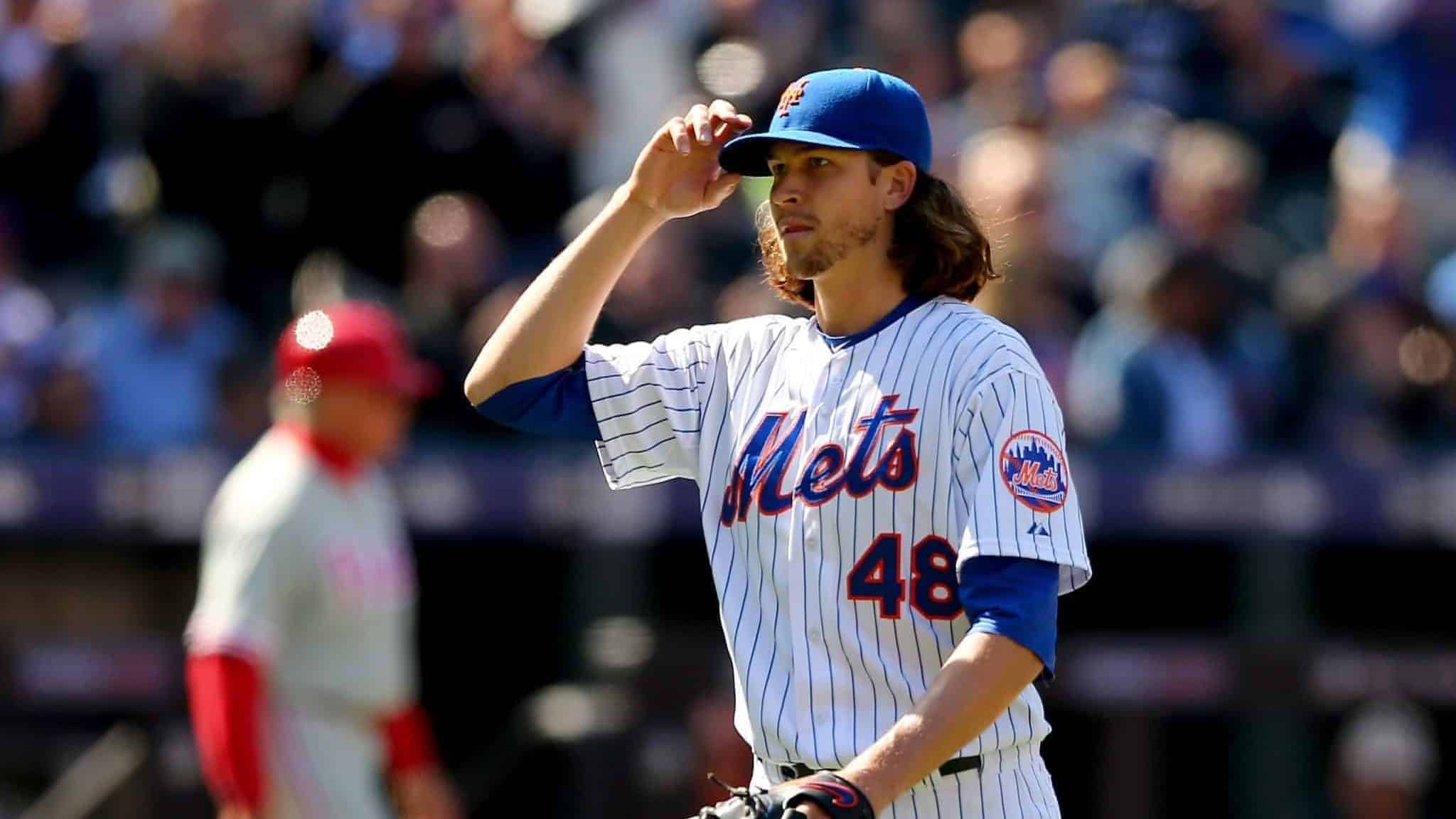 NEW YORK, NY - APRIL 13: Jacob deGrom #48 of the New York Mets salutes the fans as he is pulled from the game in the seventh inning against the Philadelphia Phillies during Opening Day on April 13, 2015 at Citi Field in the Flushing neighborhood of the Queens borough of New York City.