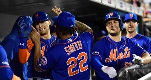 NEW YORK, NEW YORK - SEPTEMBER 27: J.D. Davis #28 and Dominic Smith #22 of the New York Mets celebrate after Davis's home run in the fourth inning of their game against the Atlanta Braves at Citi Field on September 27, 2019 in the Flushing neighborhood of the Queens borough of New York City.