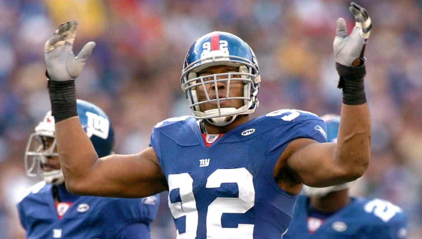 New York Giants defensive end #92 Michael Strahan works the home crowd during the game against the Minnesota Vikings at Giants Stadium in East Rutherford, NJ on November 13, 2005 The Vikings won, 24-21.