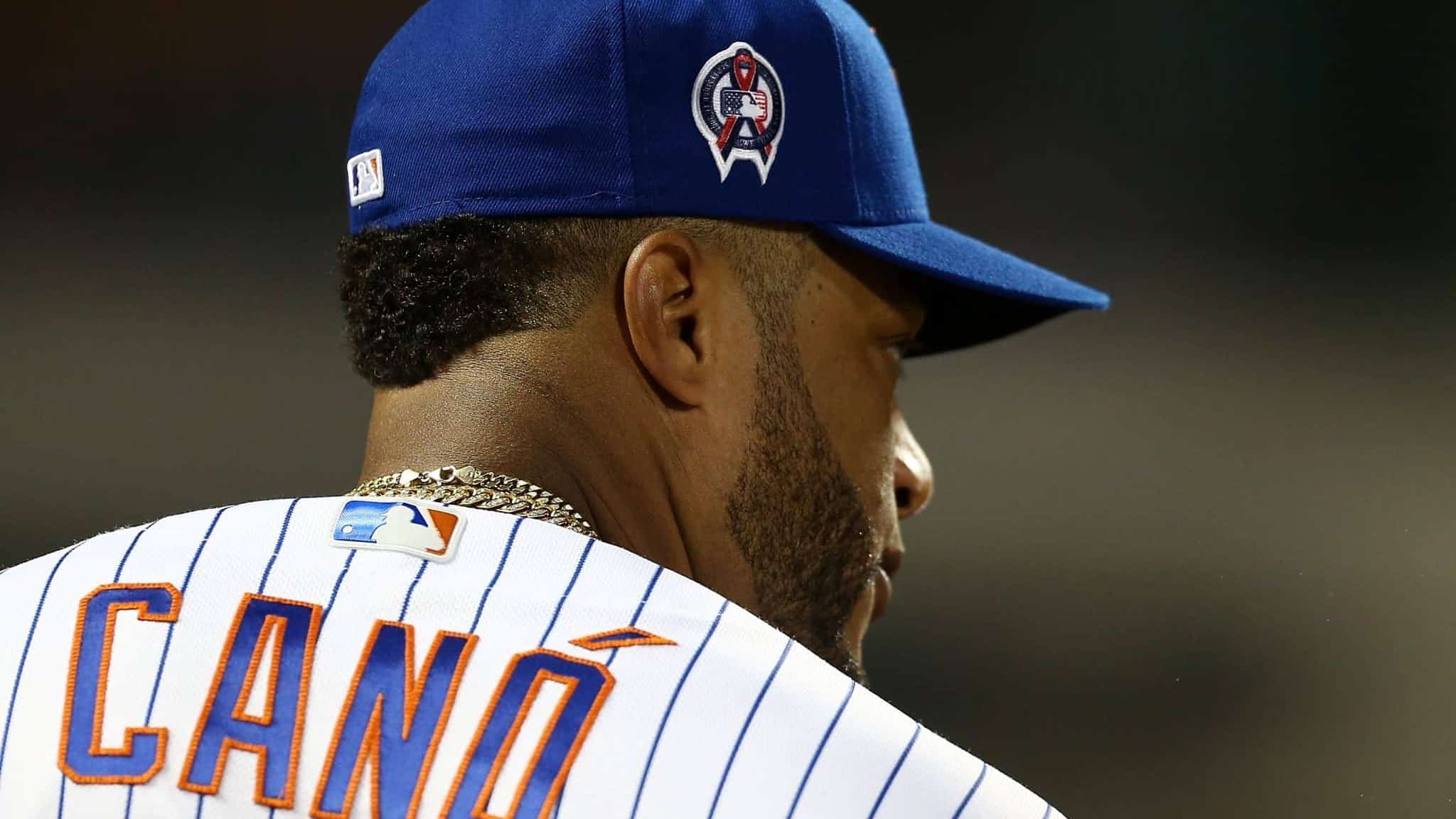 NEW YORK, NEW YORK - SEPTEMBER 11: Robinson Cano #24 of the New York Mets looks on wearing a patch on his cap in honor of the 18th anniversary of the September 11, 2001 terror attacks prior to the game against the Arizona Diamondbacks at Citi Field on September 11, 2019 in the Queens borough of New York City.