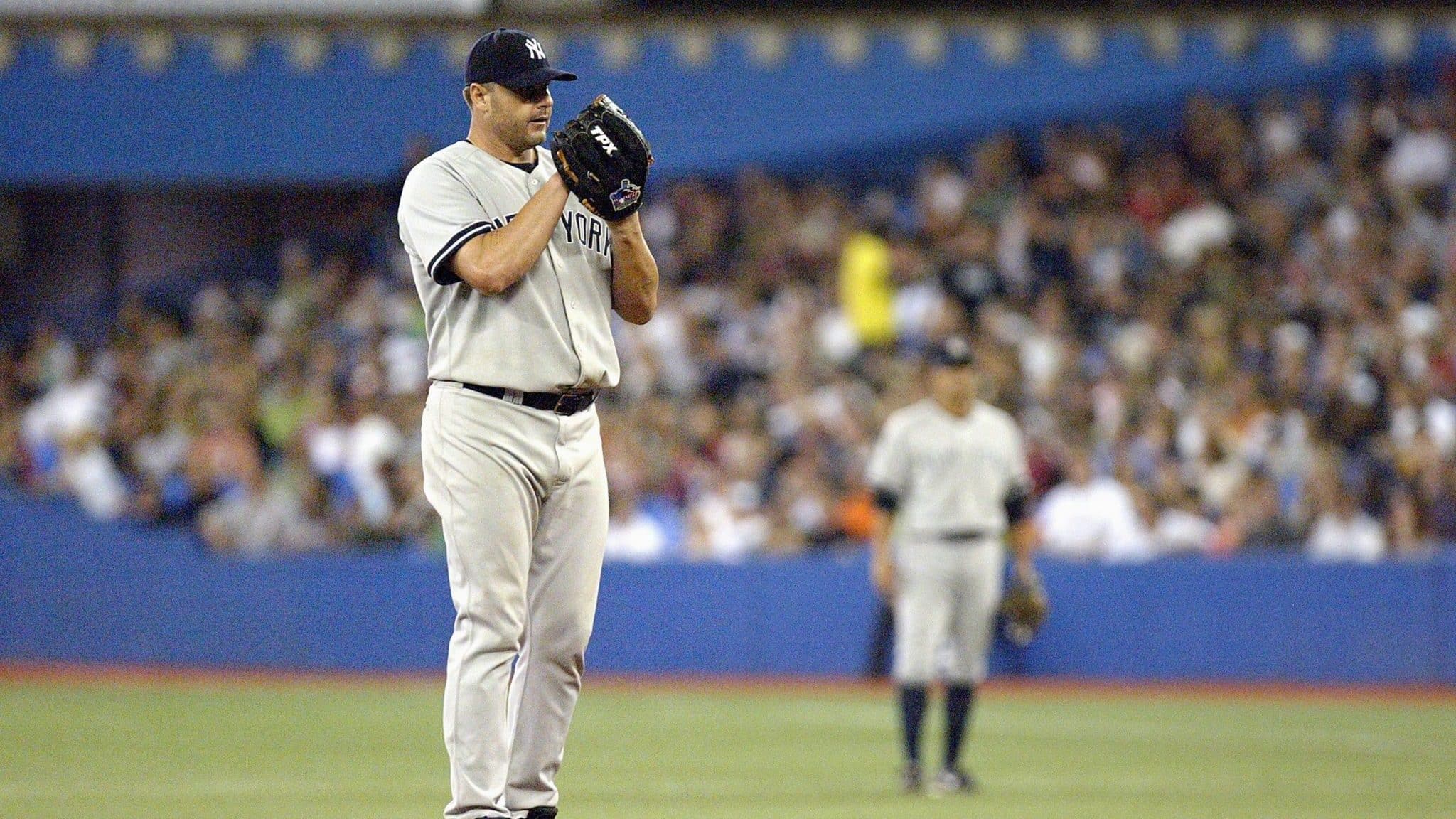 TORONTO - AUGUST 7: Roger Clemens #22 of the New York Yankees linesup the pitch during the game against the Toronto Blue Jays at the Rogers Centre August 7, 2007 in Toronto, Ontario.