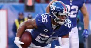 EAST RUTHERFORD, NEW JERSEY - DECEMBER 15: Saquon Barkley #26 of the New York Giants in action against the Miami Dolphins during their game at MetLife Stadium on December 15, 2019 in East Rutherford, New Jersey.