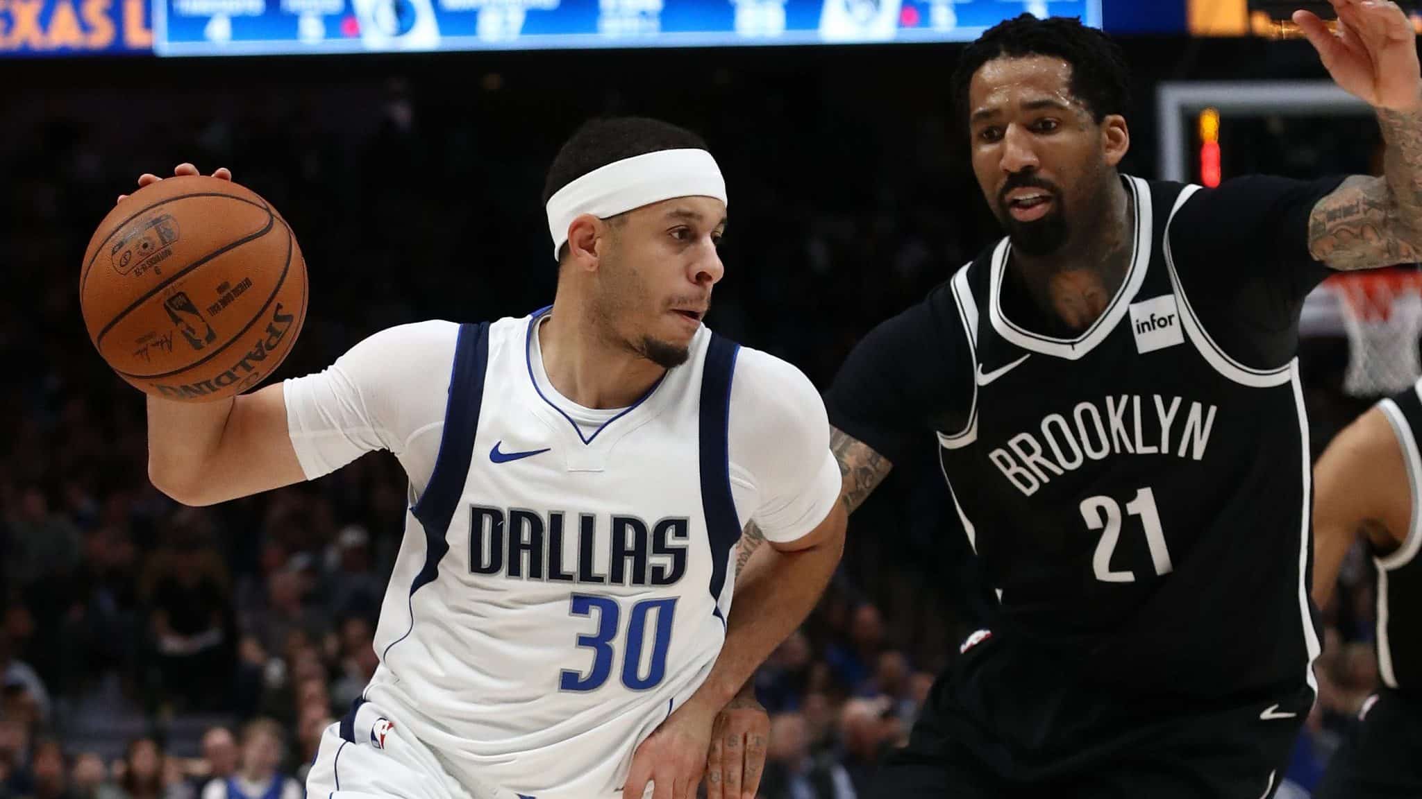 DALLAS, TEXAS - JANUARY 02: Seth Curry #30 of the Dallas Mavericks dribbles the ball against Wilson Chandler #21 of the Brooklyn Nets at American Airlines Center on January 02, 2020 in Dallas, Texas. NOTE TO USER: User expressly acknowledges and agrees that, by downloading and or using this photograph, User is consenting to the terms and conditions of the Getty Images License Agreement.