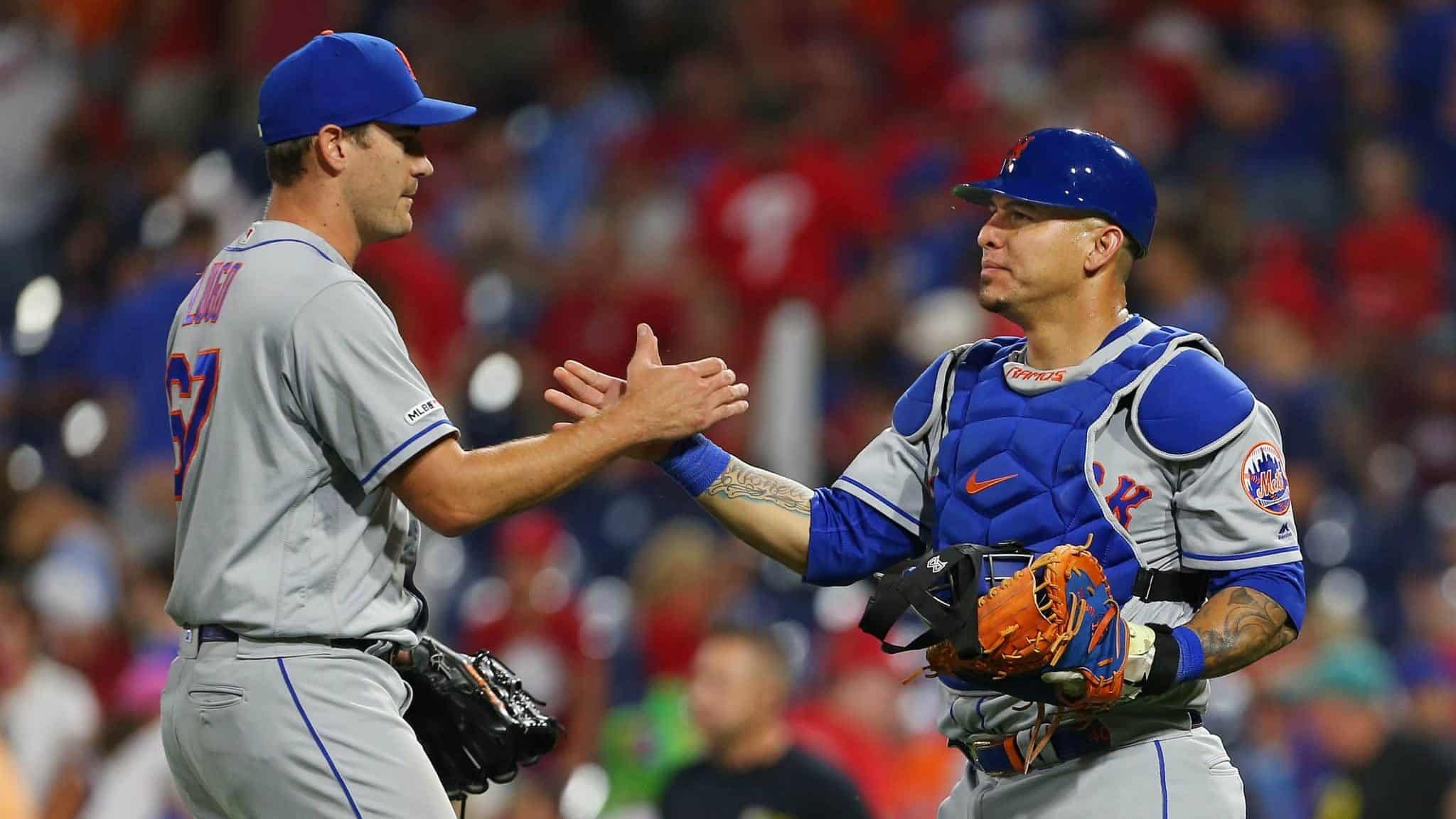 PHILADELPHIA, PA - AUGUST 31: Closer Seth Lugo #67 is congratulated by catcher Wilson Ramos #40 after defeating the Philadelphia Phillies 6-3 in a game at Citizens Bank Park on August 31, 2019 in Philadelphia, Pennsylvania.