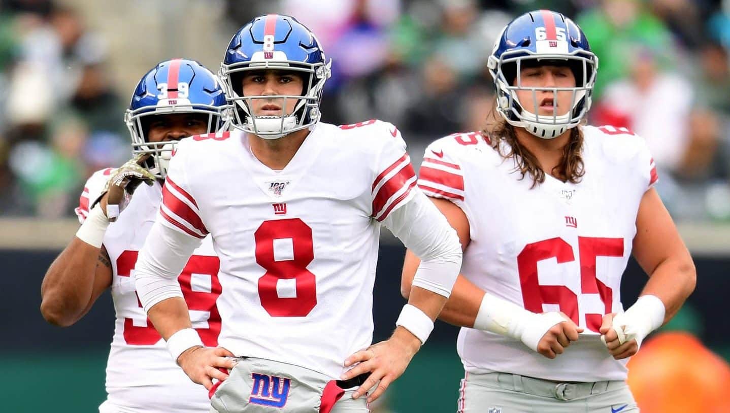 EAST RUTHERFORD, NEW JERSEY - NOVEMBER 10: Daniel Jones #8 and Nick Gates #65 of the New York Giants look on during the first half of their game against the New York Jets at MetLife Stadium on November 10, 2019 in East Rutherford, New Jersey.
