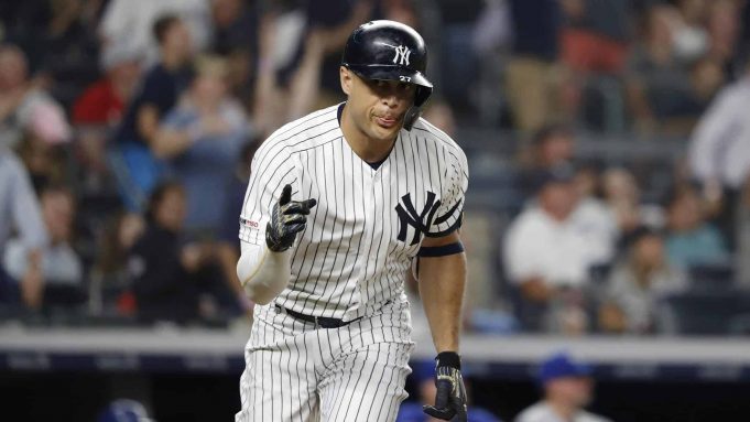 NEW YORK, NEW YORK - JUNE 24: Giancarlo Stanton #27 of the New York Yankees reacts to the dugout after hitting a three run home run against the Toronto Blue Jays in the sixth inning at Yankee Stadium on June 24, 2019 in New York City.