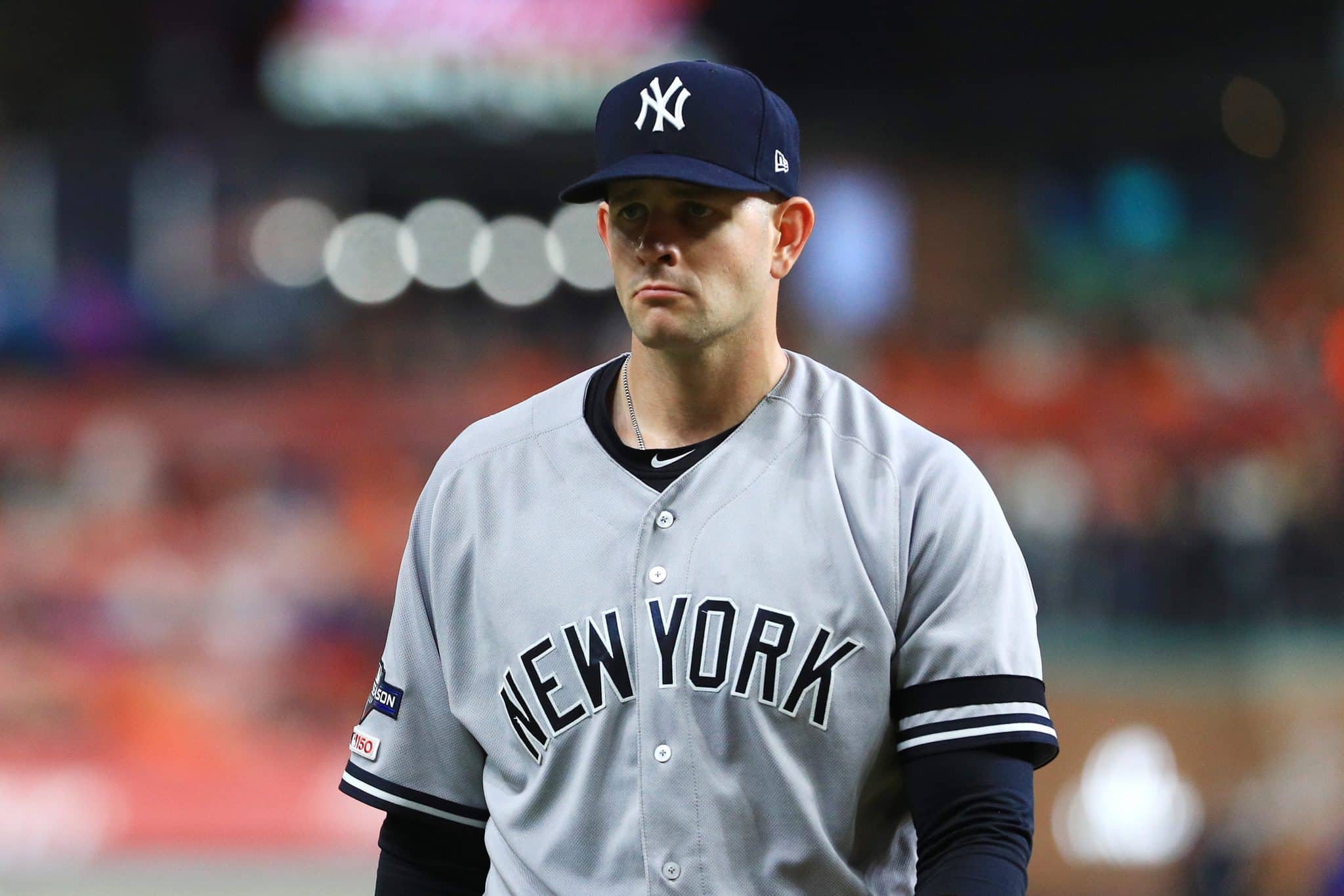 HOUSTON, TEXAS - OCTOBER 13: James Paxton #65 of the New York Yankees walks to the dugout after pitching during the first inning against the Houston Astros in game two of the American League Championship Series at Minute Maid Park on October 13, 2019 in Houston, Texas.