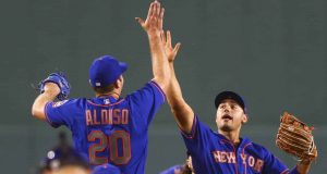 BOSTON, MA - JULY 28: Pete Alonso #20 of the New York Mets high fives Michael Conforto #30 after a victory over the Boston Red Sox at Fenway Park on July 28, 2020 in Boston, Massachusetts.