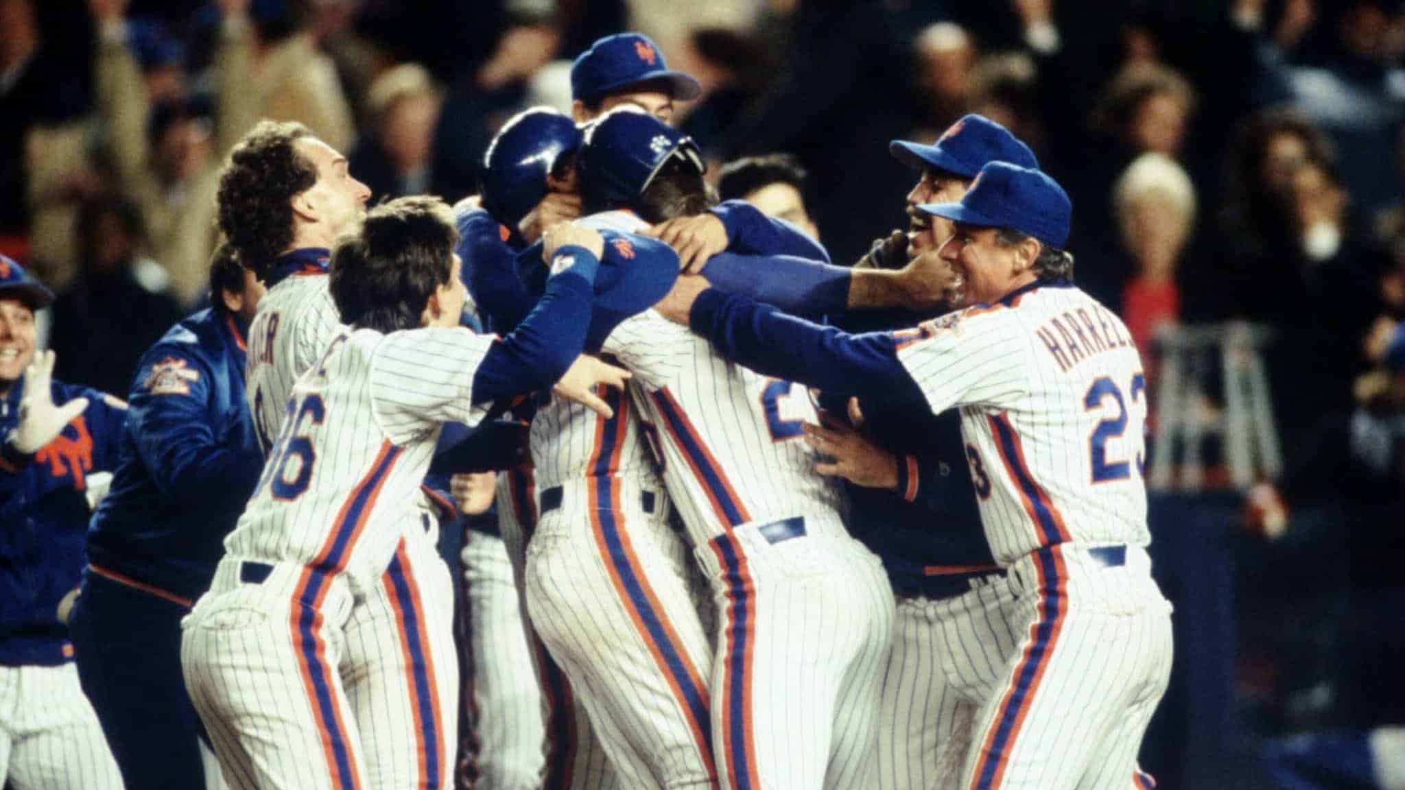 OCT 1986: THE NEW YORK METS CELEBRATE DURING THE METS 4-3 WIN OVER THE BOSTON RED SOX IN GAME 6 OF THE WORLD SERIES AT SHEA STADIUM IN NEW YORK, NEW YORK.
