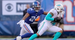 EAST RUTHERFORD, NEW JERSEY - DECEMBER 15: Albert Wilson #15 of the Miami Dolphins carries the ball as Julian Love #24 of the New York Giants defends in the second quarter at MetLife Stadium on December 15, 2019 in East Rutherford, New Jersey.