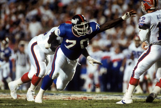 TAMPA, FL - JANUARY 27: Defensive tackle Leonard Marshall #70 of the New York Giants pressures quarterback Jim Kelly #12 of the Buffalo Bills during Super Bowl XXV at Tampa Stadium on January 27, 1991 in Tampa, Florida. The Giants defeated the Bills 20-19.