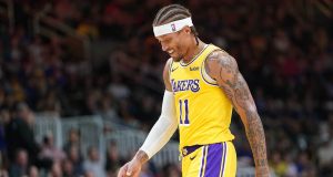 SAN JOSE, CA - OCTOBER 12: Michael Beasley #11 of the Los Angeles Lakers walks off the court smiling after he received two technical fouls and was ejected from the game against the Golden State Warriors during the second half of their NBA preseason basketball game at SAP Center on October 12, 2018 in San Jose, California. NOTE TO USER: User expressly acknowledges and agrees that, by downloading and or using this photograph, User is consenting to the terms and conditions of the Getty Images License Agreement.