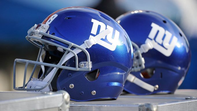 NASHVILLE, TN - DECEMBER 07: Helmets of the New York Giants rests on the sideline during a game against the Tennessee Titans at LP Field on December 7, 2014 in Nashville, Tennessee.