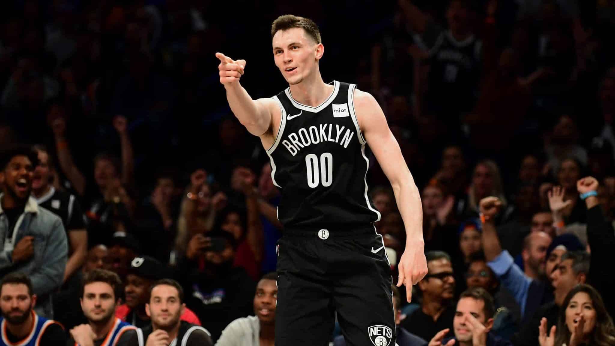 NEW YORK, NEW YORK - OCTOBER 25: Rodions Kurucs #00 of the Brooklyn Nets celebrates his three-pointer in the first half of their game against the New York Knicks at Barclays Center on October 25, 2019 in the Brooklyn borough of New York City. NOTE TO USER: User expressly acknowledges and agrees that, by downloading and or using this photograph, User is consenting to the terms and conditions of the Getty Images License Agreement.