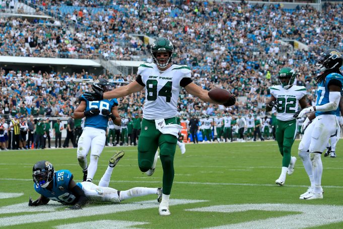 JACKSONVILLE, FLORIDA - OCTOBER 27: Ryan Griffin #84 of the New York Jets runs for a touchdown during the game against the Jacksonville Jaguars at TIAA Bank Field on October 27, 2019 in Jacksonville, Florida.