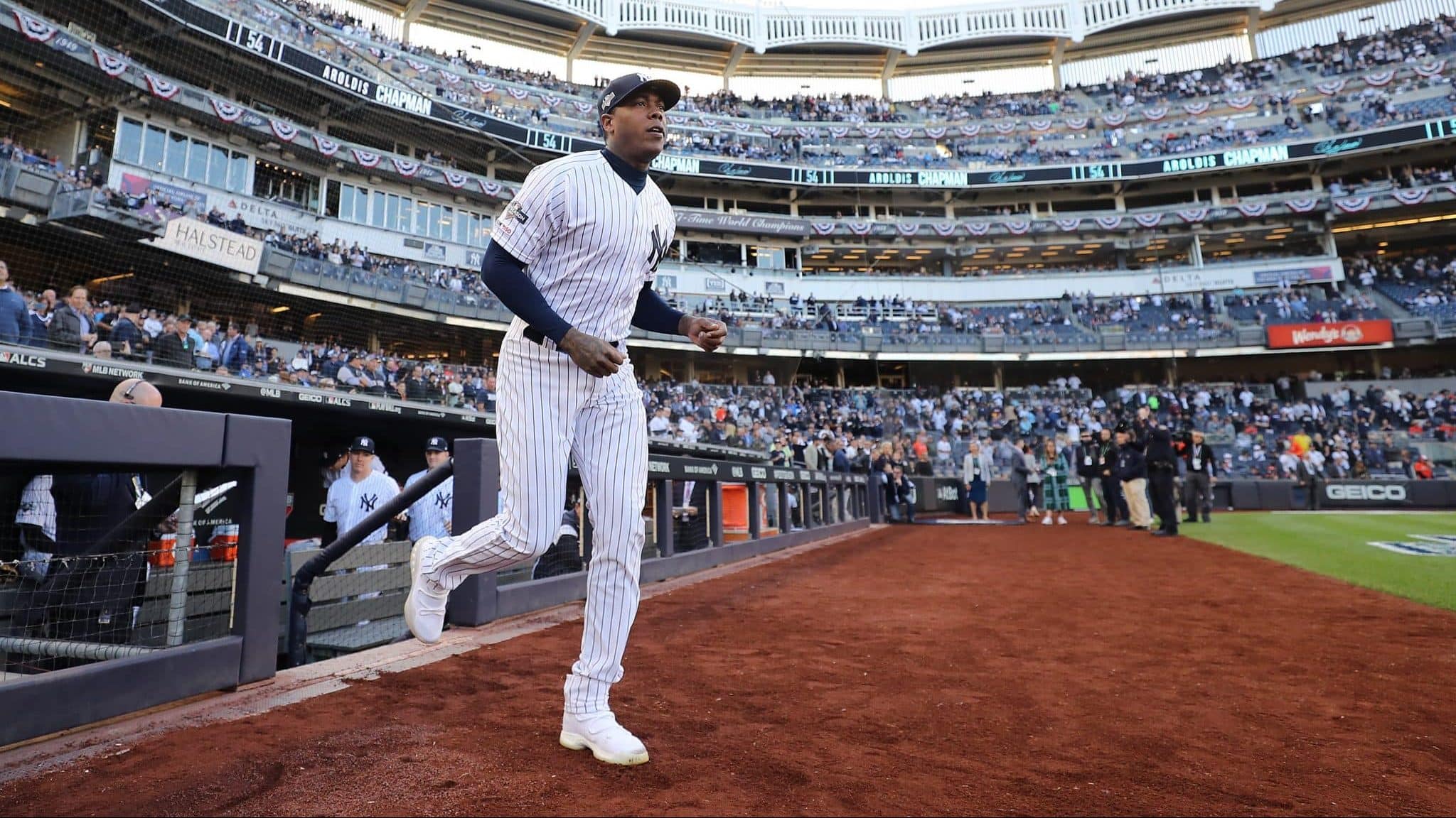 NEW YORK, NEW YORK - OCTOBER 15: Aroldis Chapman #54 of the New York Yankees takes the field as he is introduced prior to game three of the American League Championship Series against the Houston Astros at Yankee Stadium on October 15, 2019 in New York City.