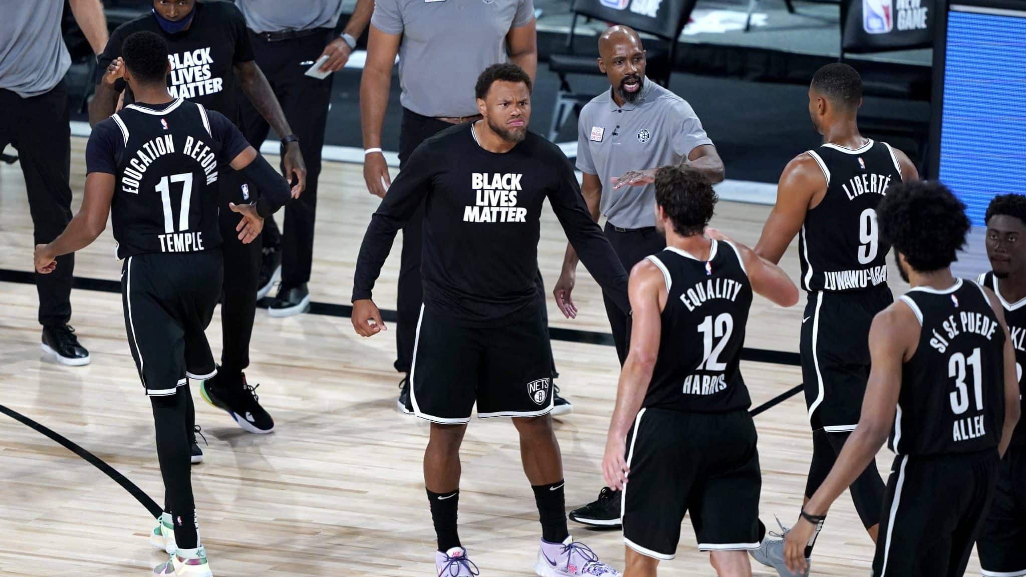LAKE BUENA VISTA, FLORIDA - AUGUST 13: Justin Anderson of the Brooklyn Nets reacts as teammates walk off the floor for a timeout in the second half against the Portland Trail Blazers at AdventHealth Arena at ESPN Wide World Of Sports Complex on August 13, 2020 in Lake Buena Vista, Florida. NOTE TO USER: User expressly acknowledges and agrees that, by downloading and or using this photograph, User is consenting to the terms and conditions of the Getty Images License Agreement.