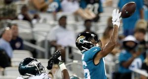 JACKSONVILLE, FLORIDA - AUGUST 15: C.J. Board #16 of the Jacksonville Jaguars catches a pass against Deiondre' Hall #36 of the Philadelphia Eagles in the second quarter during a preseason game at TIAA Bank Field on August 15, 2019 in Jacksonville, Florida.