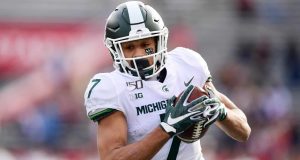 PISCATAWAY, NEW JERSEY - NOVEMBER 23: Cody White #7 of the Michigan State Spartans runs the ball in the second half of their game against the Rutgers Scarlet Knights at SHI Stadium on November 23, 2019 in Piscataway, New Jersey.